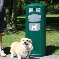 Happy dog in front of the Retriever City Pet Waste Station