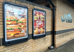 Two Glasdon, Inc. Advocate wall mounted poster display sidewalk signs