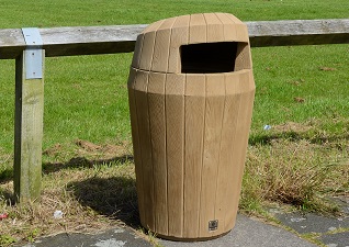 Sherwood™ Hooded Wood-Look External Trash Receptacle in light wood by school yard