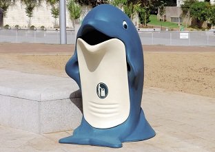 Glasdon, Inc. Splash dolphin shaped trash can in a childrens park