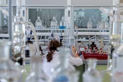 Technician in lab doing experiment