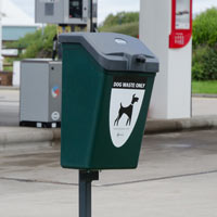 Pet waste station in gas station forecourt