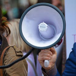 woman holding megaphone