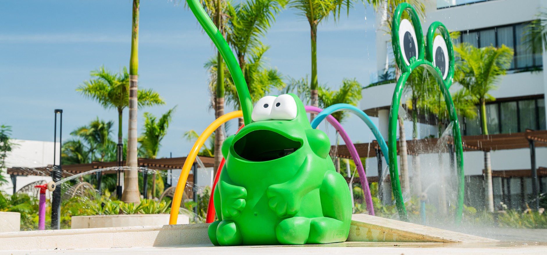 Glasdon frog-shaped Froggo litter bin next to a playground in Donoma Las Terrenas Beach Resort and Spa in the Dominican Republic
