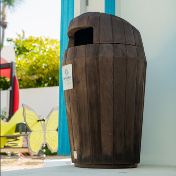 Glasdon wood-effect Sherwood litter bin next to a building in Donoma Las Terrenas Beach Resort and Spa in the Dominican Republic