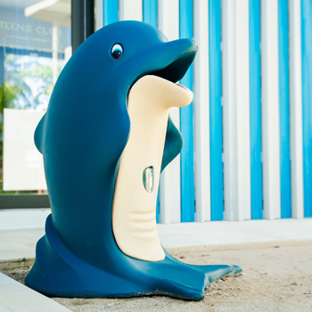 Glasdon dolphin-shaped Splash litter bin on sand in Donoma Las Terrenas Beach Resort and Spa in the Dominican Republic