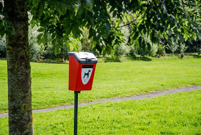 Fido™ 25 Pet Waste Station - mounted to a post in a park